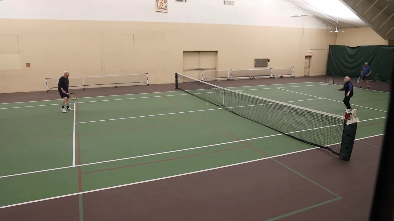 RecFit's indoor court seen from the corner, with players at the net